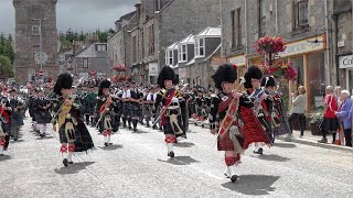 Chieftain leads the massed pipe bands parade through Dufftown to the 2022 Dufftown Highland Games [upl. by Alac]