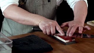 Sharpening a Shun knife on a whetstone [upl. by Yelsgnik]