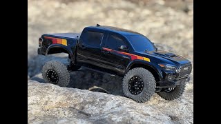 Carisma SCA1e Toyota Tacoma first run with new tires wheels and esc tune out the box Cibolo Creek [upl. by Annoyik]