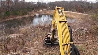 Yanmar VIO506A mowing with the brush hog [upl. by Nnahgiel]