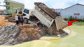 Unexpected Dump Truck Driver Landslide Struck to waterBulldozer Clearing Pushing soil To Deep [upl. by Wenn]