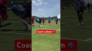 Titans rookie JC Latham coaching his teammate through the Bertha sled drill at OTAs [upl. by Ttsepmet809]