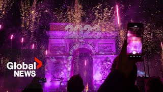 New Years 2023 Paris France gets the party started with fireworks smoke show over Arc de Triomphe [upl. by Rorry223]