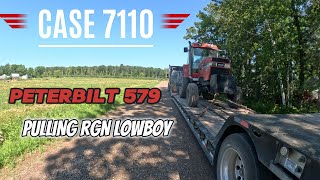 Peterbilt 579 hauling Case 7110 on RGN lowboy in Minnesota [upl. by Wilie370]