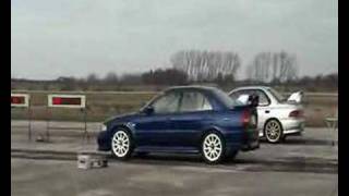 Mitsubishi Evolution VI 6 vs Subaru Impreza 14 mile race [upl. by Neerihs]