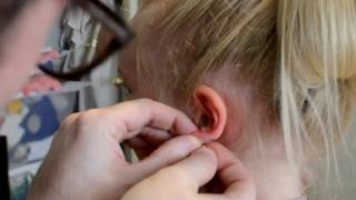 Painless Ear Piercing By Needle [upl. by Deni]