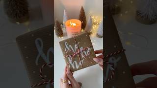 Paint pen  brown paper  hand lettered Christmas gift wrap 🎅🏼🤍 christmasdiy christmasgifts [upl. by Lorant]